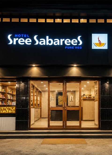 Hotel Sree Sabarees Arasaradi branch storefront lighting at night